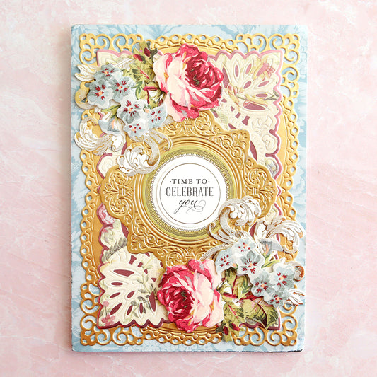 Blue, pink and gold celebratory card with roses and flowers