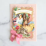Easter scene on a pink card with diecut layers