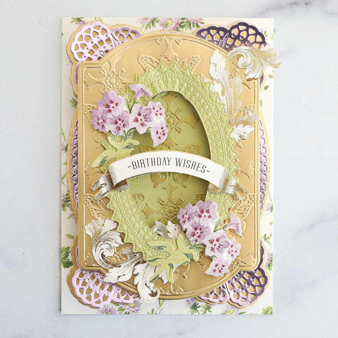 Multilayered card with inked, embossed butterfly layer, purple flowers and gold flourishes
