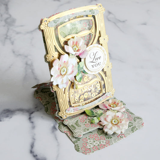 floral card in the shape of an hourglass with flowers and I love you sentiiment