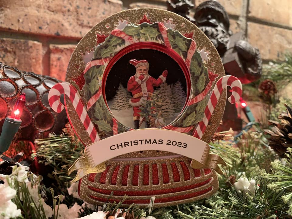 snowglobe ornament with wreath and Santa