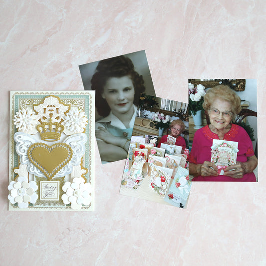 a beautiful silver and white card with photos of Cindi's mother Anna with her cards.