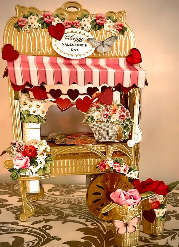 a valentine's day display with flowers and hearts.