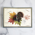 Folded fall card with turkey inside, sentiment and leaf