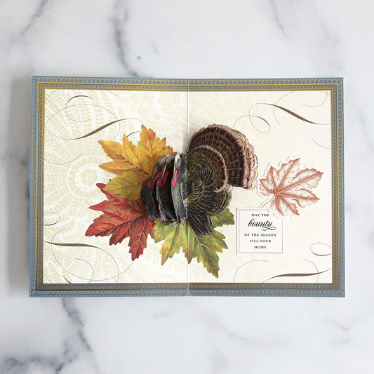 Folded fall card with turkey inside, sentiment and leaf