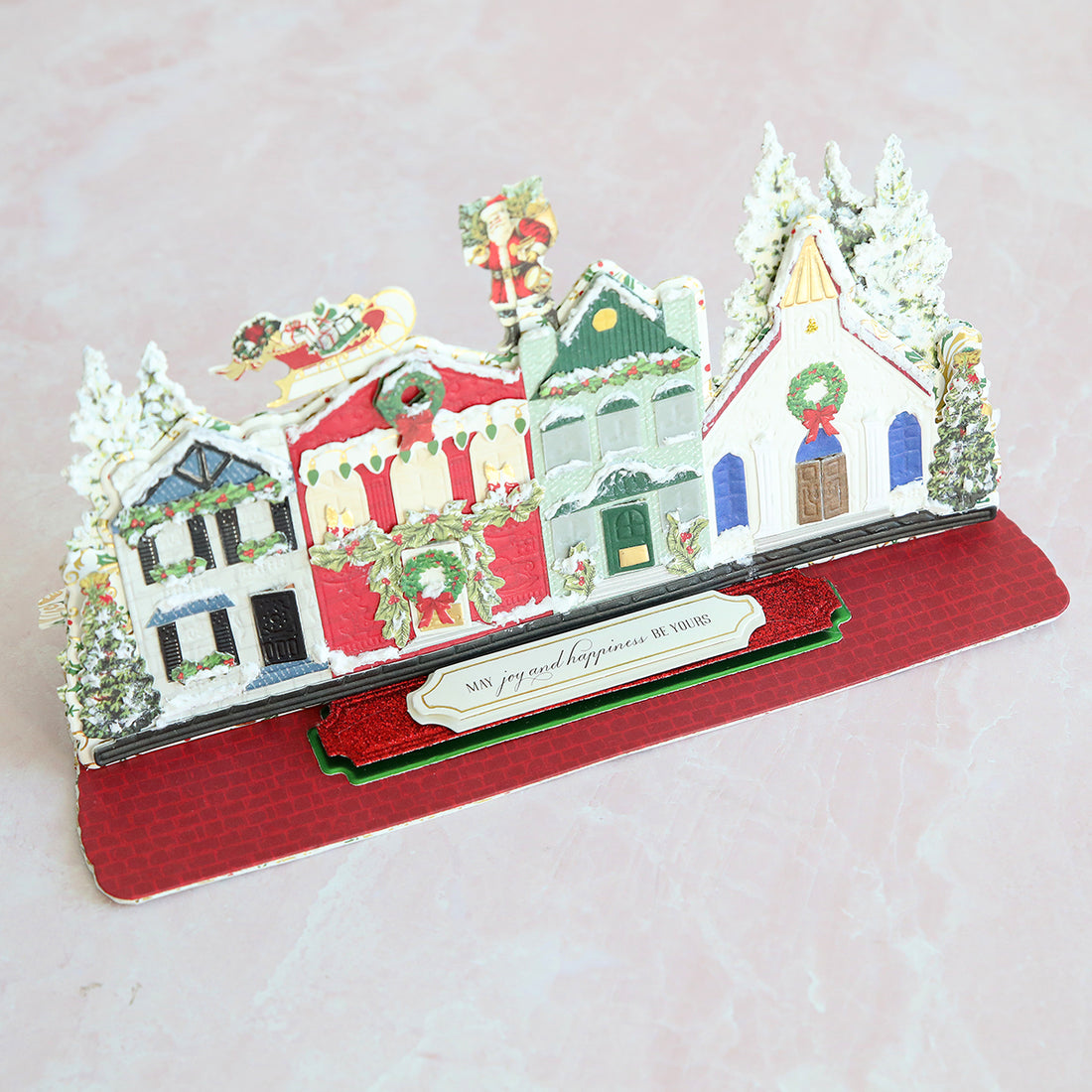 colorful, paper-pieced village easel card with tiny trees