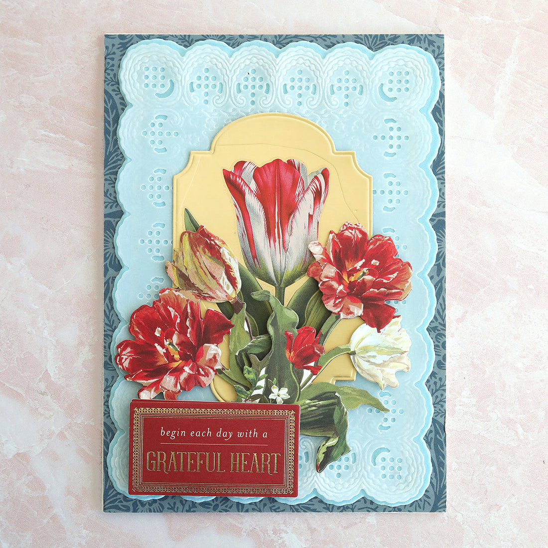 Blue card and layers with tulips and Begin Each Day with a Grateful Heart sentiment