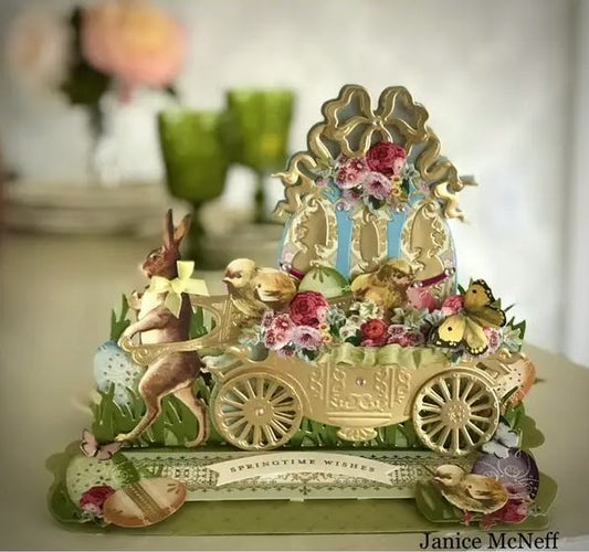 a decorative figurine of a horse drawn carriage.