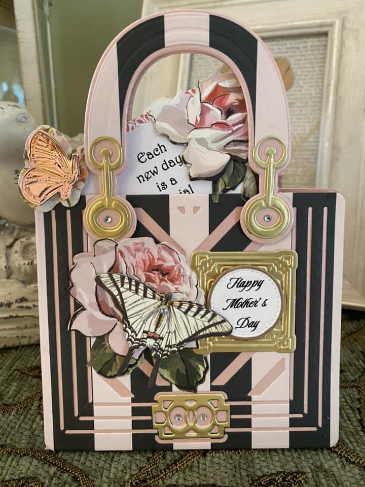 a close up of a card with flowers and a butterfly.