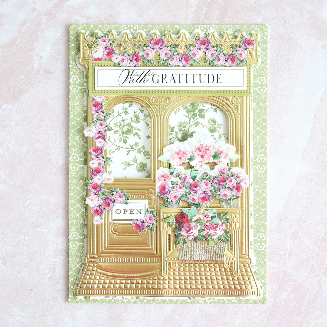 a greeting card with a picture of a flower shop.