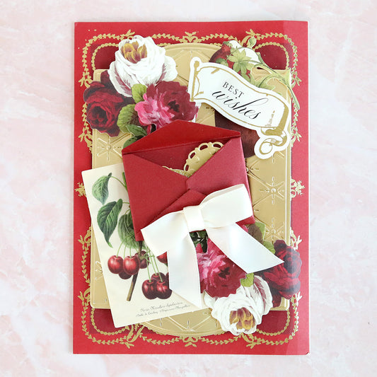 Red card with quilted gold layer, cherry botanical layer and red envelope