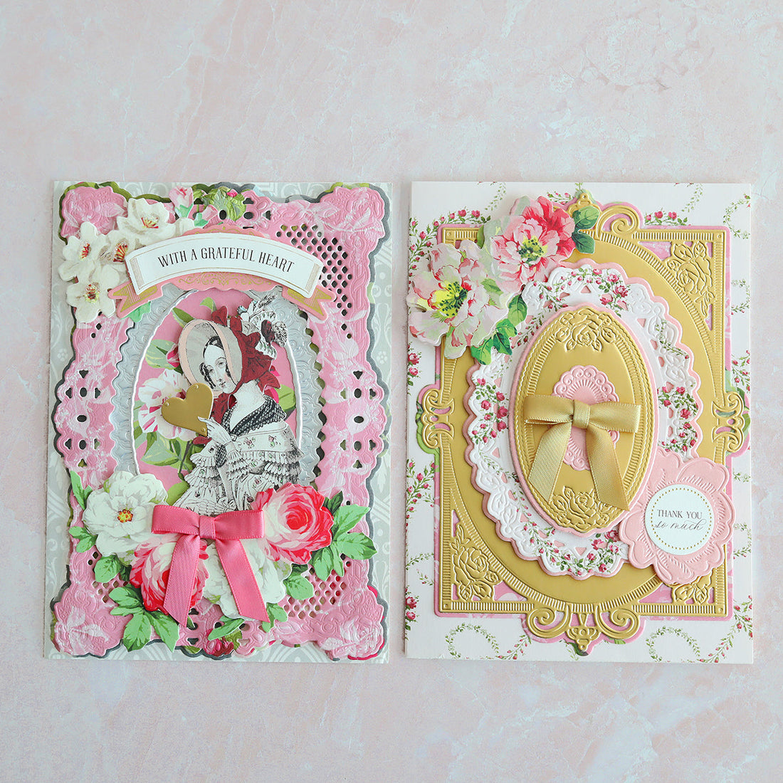 Two white and pink cards with floral stickers, diecuts and more