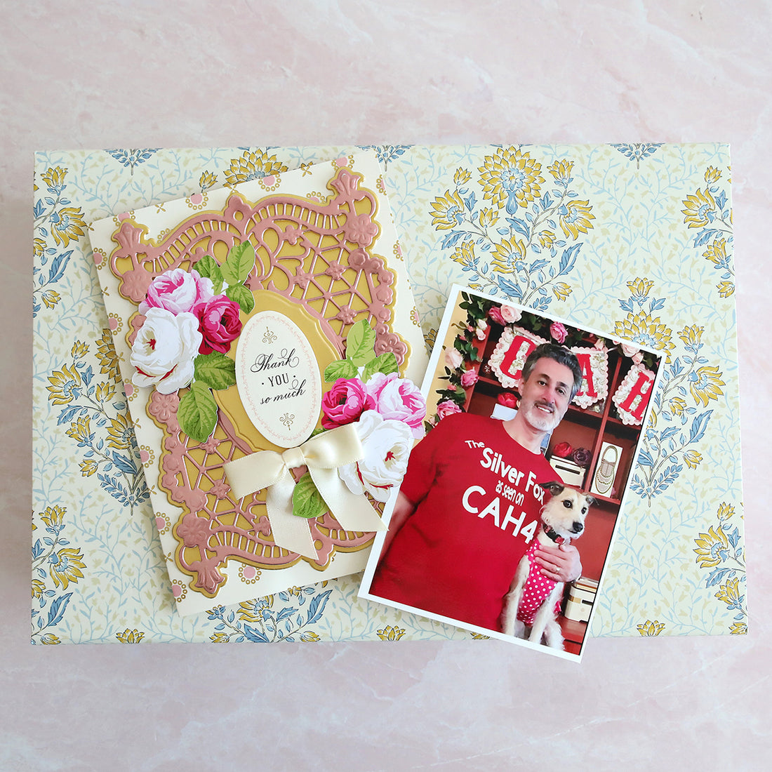 a patterned box, card and photo of CAH4 guest's husband