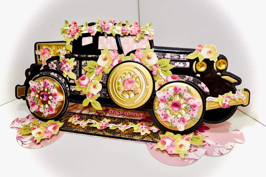 a card with a truck decorated with flowers.