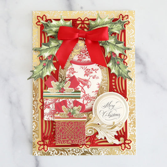 A christmas card with red and gold decorations.