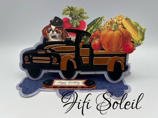 Black and copper truck with fall produce and a spaniel.