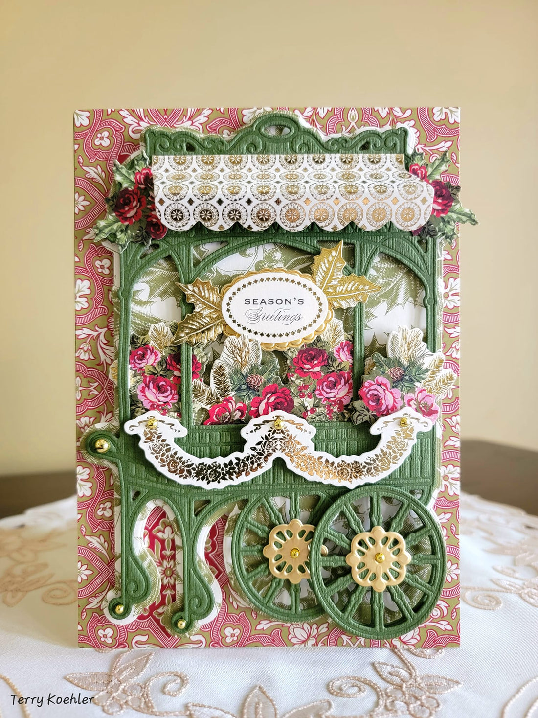 A card with a carriage and flowers on it.