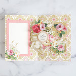 An Annalise card with signature card, intricate middle and swing out squares with floral stickers