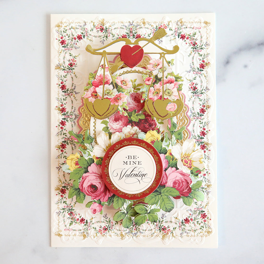 Intricate valentine that is embossed and made up of valentine ephemera