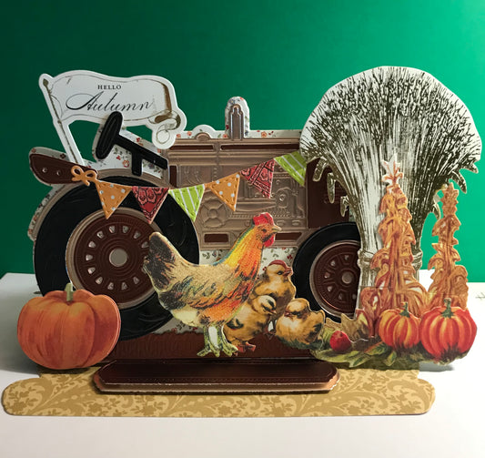 Harvest tractor with pumpkins, wheat and chicken