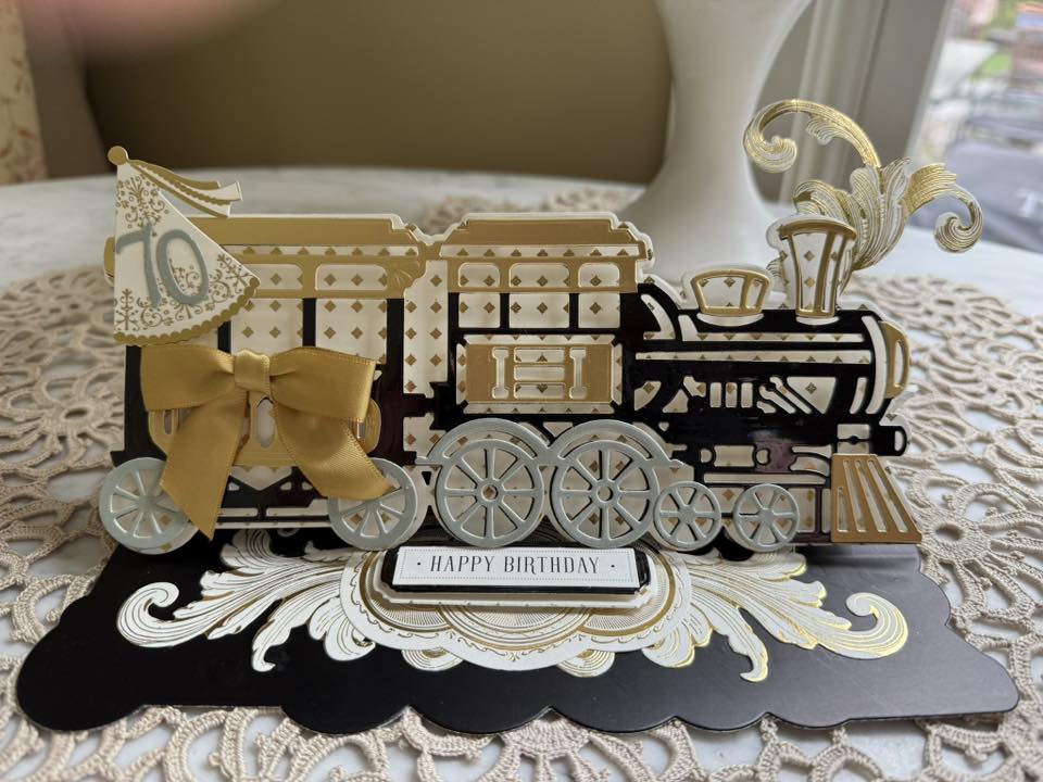 Black, gold and silver train card for 70th birthday