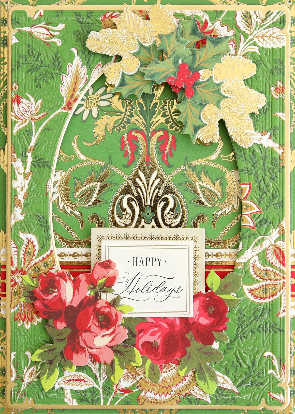 Created with the Jasmine Holiday Papercrafting Kit, this decorative holiday card showcases gold, red, and green patterns, holly, and roses. Crafted from patterned cardstock and enhanced with festive embellishments, it features “Happy Holidays” prominently in the center.