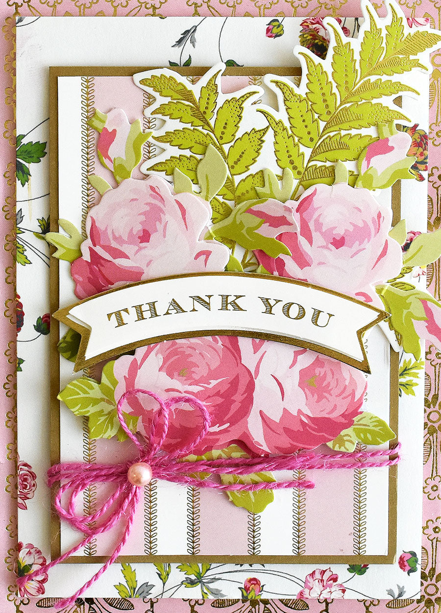 Introducing the Beautiful Botanical Bundle: a decorative thank you card adorned with pink roses, green leaves, and a pink string bow on a floral background—perfect for botanical card making or pairing with your favorite antique floral craft supplies.