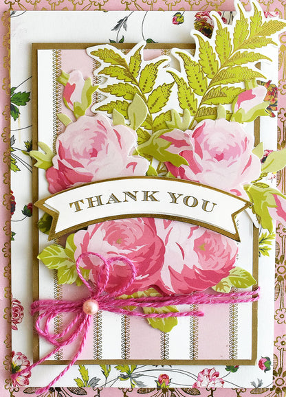 Introducing the Beautiful Botanical Bundle: a decorative thank you card adorned with pink roses, green leaves, and a pink string bow on a floral background—perfect for botanical card making or pairing with your favorite antique floral craft supplies.