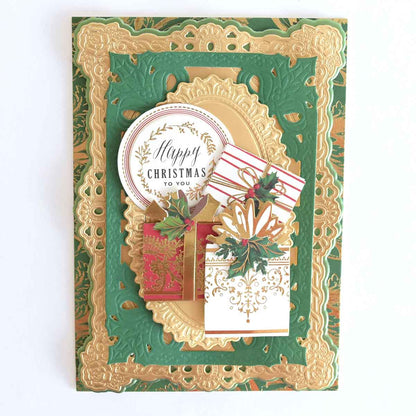 Reason for the Season Sticker Bundle featuring a decorative Christmas card with layered frames, a circular “Happy Christmas to you” sentiment, and dimensional embellishments of three holly-adorned gifts.