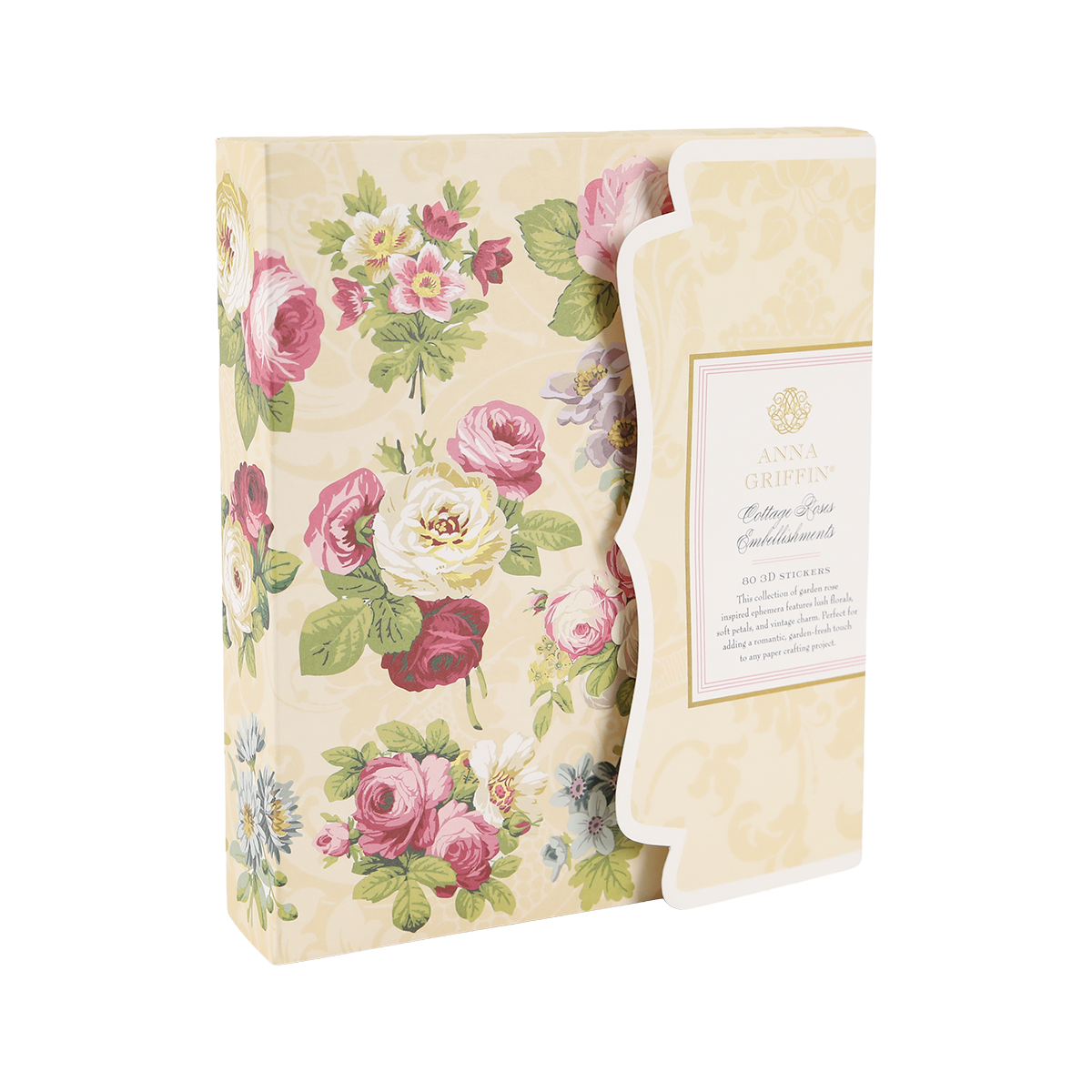 Decorative box with a scalloped edge, featuring a floral pattern and filled with assorted stationery and the delightful Cottage Roses Embellishments from Anna Griffin’s “Cotton Pass” collection.
