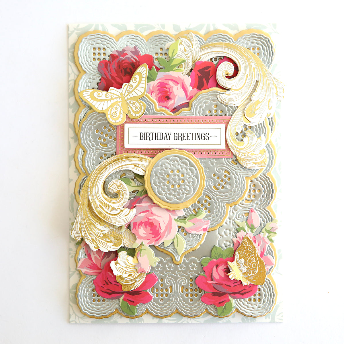 A card with 3D lace doily dies, adorned with roses and flowers, exuding an antique feel perfect for Valentine's cards.