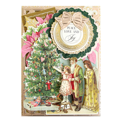 A Radiant Holiday Wreath and Bow Bundle layered paper craft Christmas card featuring a girl, Santa, and an angel decorating a tree with 3D wreath dies, a bow, and the text “PEACE. LOVE AND Joy.”