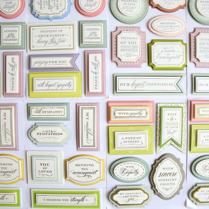 An assortment of sympathy and support greeting cards displayed in rows.