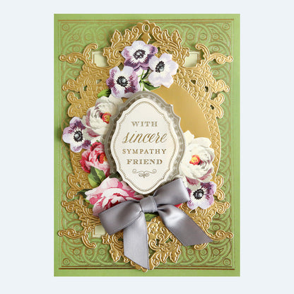 A sympathy greeting card with floral embellishments and a ribbon, featuring the text "with sincere sympathy friend.