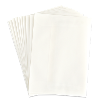 A stack of blank, white sheets of paper fanned out on a light surface—ideal for pairing with the 10 Pack Vellum A7 Envelopes (5.25″ x 7.25″) to create elegant invitations.