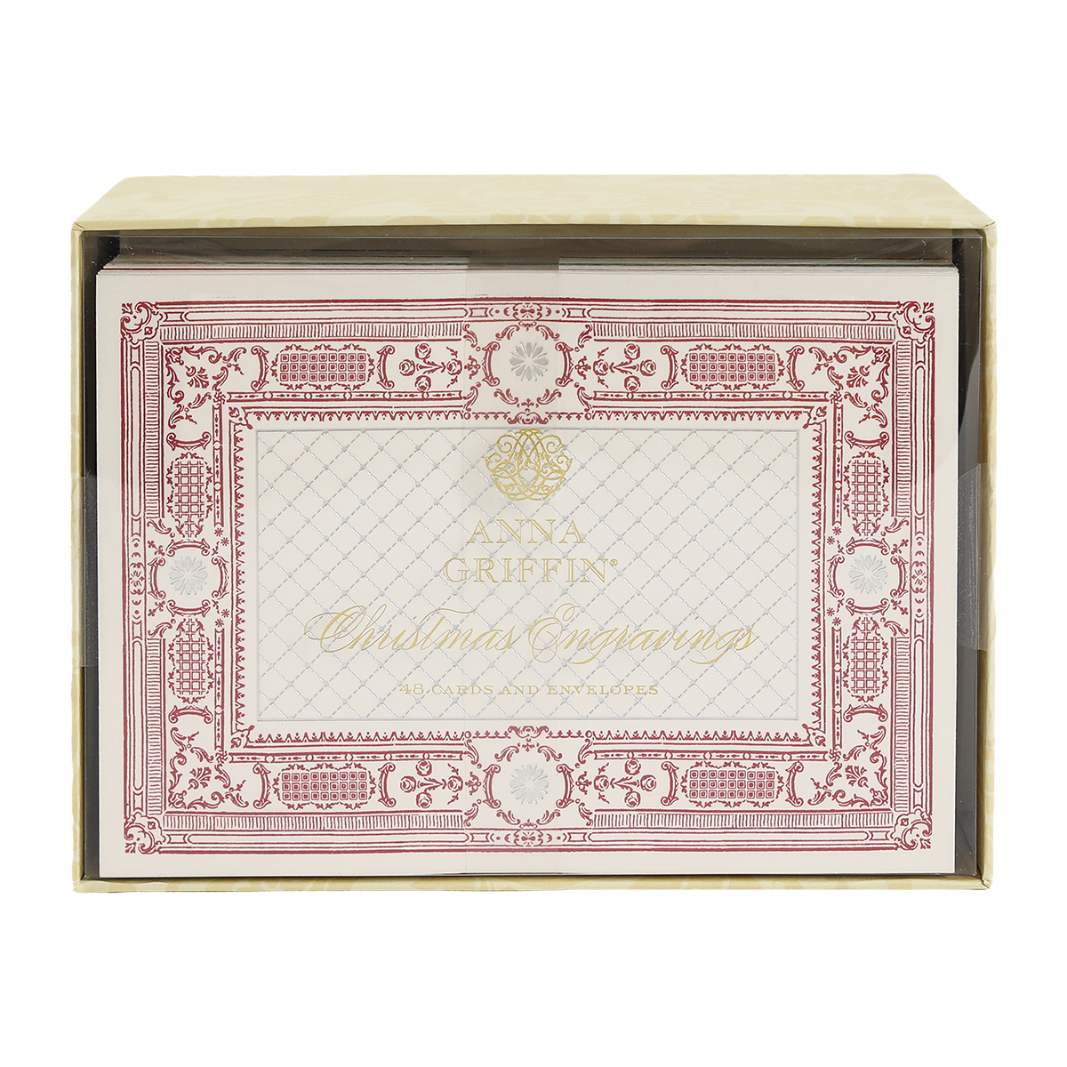 A box of Christmas Engravings Cards and Envelopes, featuring ornate red and gold detailing on the cards, partially visible through a clear box window.