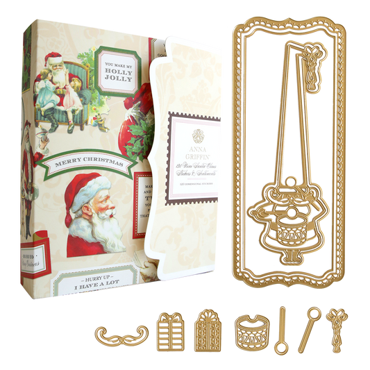 The Here Comes Santa Slimline Set includes a box of vintage-style Christmas stickers, a long, rectangular gold metal die, and several coordinating Santa dies for handmade holiday cards.