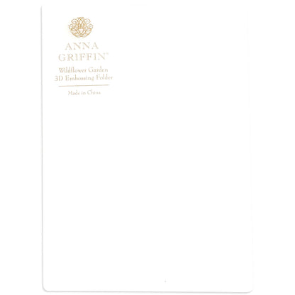 The "Wildflower 3D Folder and Dies" features elegant white packaging with gold text and a decorative emblem, suggesting the intricate designs inside. Use it with cutting dies to craft your own exquisite wildflower garden of embossed art.