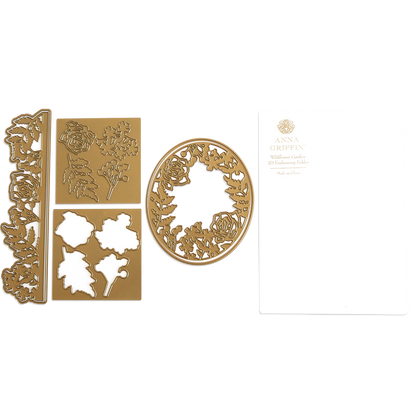 The "Wildflower 3D Folder and Dies," featuring gold metal craft dies with floral designs and an embossing folder, are attractively presented next to white "Anna Griffin" packaging. These detailed cutting dies infuse wildflower garden elegance into your creative projects.