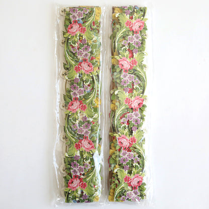 The Floral 12" Border Stickers, featuring intricately designed and vibrant floral patterns in pink, purple, green, and yellow, are perfect for adding charm to handmade cards or scrapbook pages. Each set of ribbons is conveniently packaged in clear plastic.