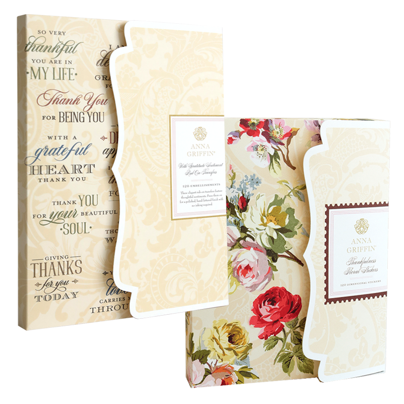 Thankful Sentiments and Floral Stickers: two packages, one with black sentiment rub-ons on cream and one with floral stickers featuring red and yellow roses.