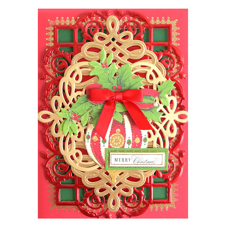 Using the Black Friday Empress Mini Bundle, you can create a festive Christmas card adorned with intricate red and gold designs, featuring holly, a red bow, and a "Merry Christmas" message.