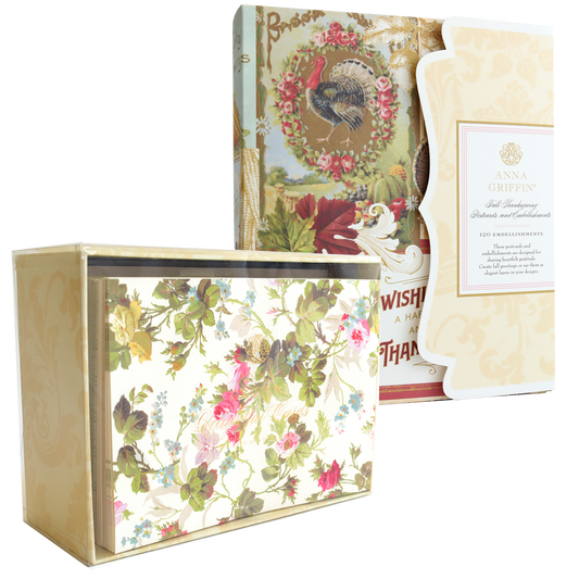 A Thanksgiving Greetings Bundle of postcards and autumn embellishments stored inside a floral-patterned box.
