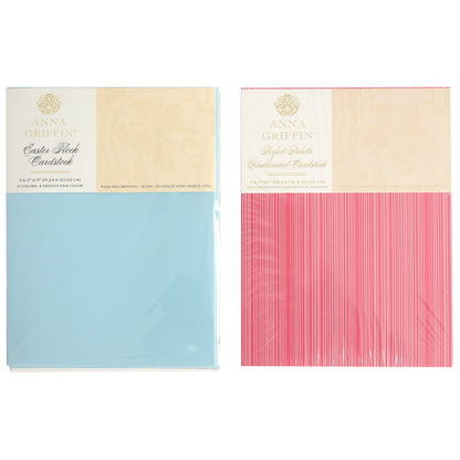 Two packs of Anna Griffin cardstock—light blue "Satin Stock" and pink "Stylish Stripes"—sealed in plastic and designed to coordinate seamlessly with the Perfect Palette Flocked and Printed Cardstock for stunning cardmaking projects.