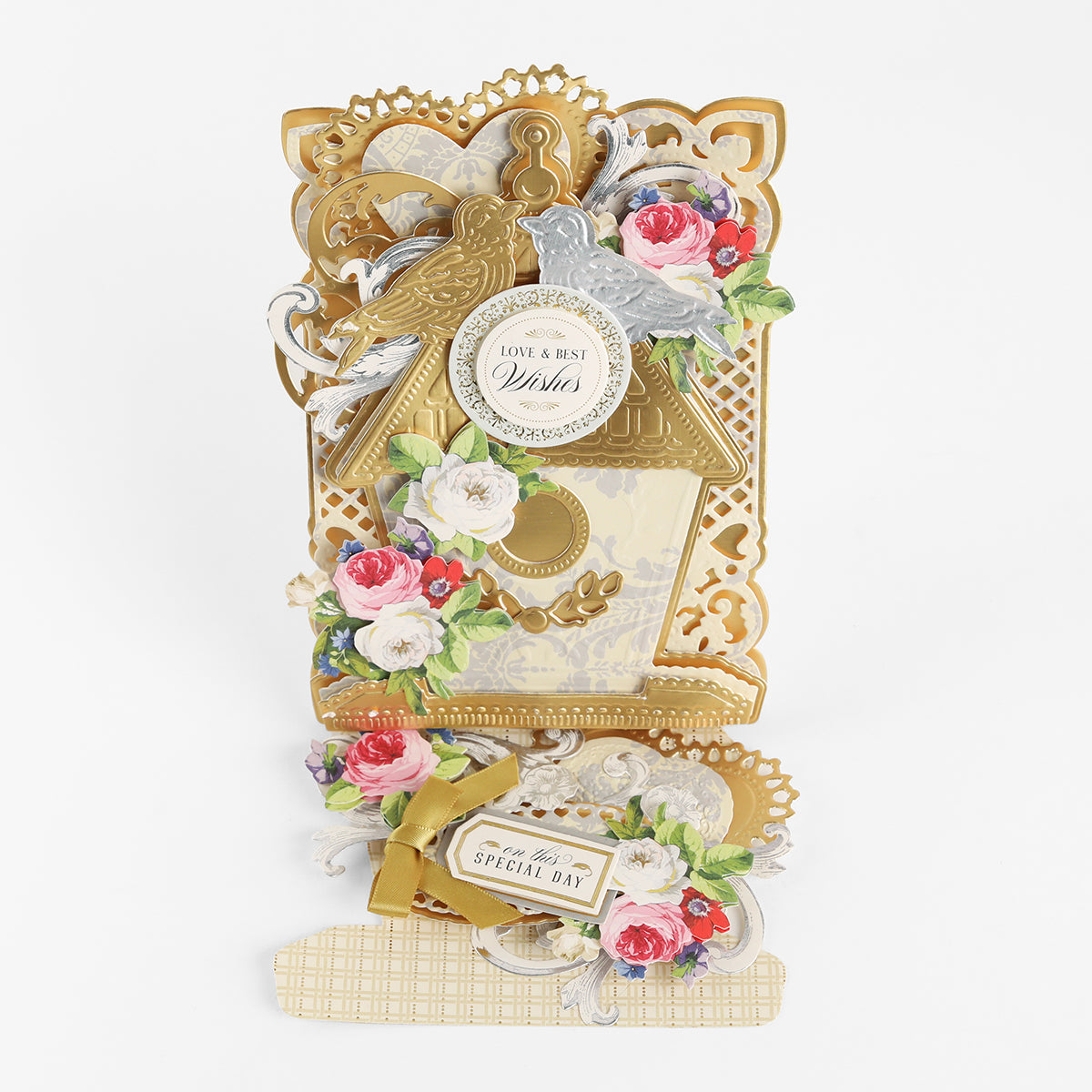Create stunning cards with the Birdhouse Easel Card Dies—designs feature an ornate pop-up gold birdhouse, floral decorations, and two birds with heartfelt messages like “Love & Best Wishes” and “For a Very Special Day” on a white background, perfect for housewarming celebrations.