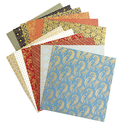 The Celebration Foil Cardstock Collection features decorative square paper sheets adorned with intricate patterns and luxurious gold foil accents, beautifully arranged in a fanned-out stack—perfect for elevating your paper crafts.