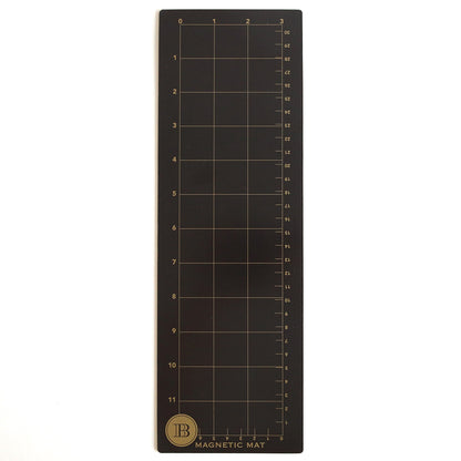 The Empress Mini 13" Full Plate Set includes a rectangular black magnetic mat with a grid numbered 0–11 vertically and 0–3 horizontally, gold "B" logo, and "MAGNETIC MAT" in the bottom left, designed for use with embossing plates.