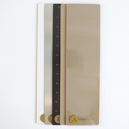 Four rectangular color and measurement samples with numbers and gold labels, made using the Empress Elite Mini Machine with 5" x 10" and 13" Plates, are stacked side by side on a white background.