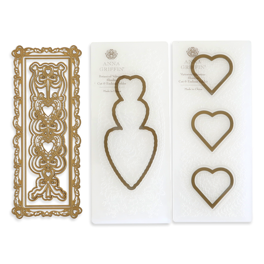 Slimline Hearts Dies and Cut Emboss Folders featuring heart-shaped and ornate rectangular metal dies on white packaging, labeled with Anna Griffin branding.