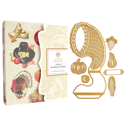 Cornucopia Harvest Easel Card Set featuring a gift box with Thanksgiving images next to gold-colored metal dies shaped as a cornucopia, pumpkin, fruit, and corn.